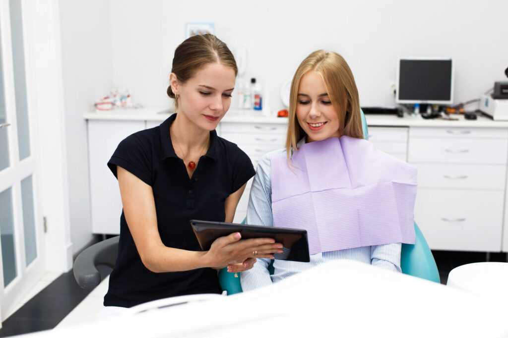 Orthodontist reviewing a 3D treatment plan with a patient at Deerpath Orthodontics in Lake Forest, IL